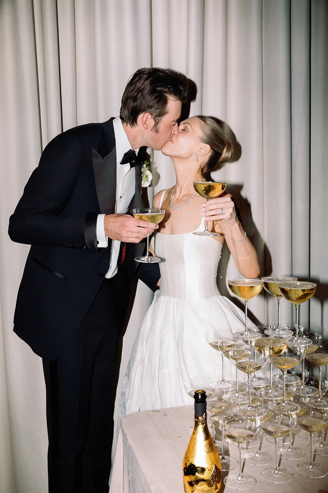 Couple sharing a champagne toast at their Stanly Ranch wedding